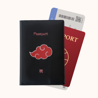 Black passport holder with red cloud design and a red passport on a white background