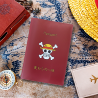 Red passport holder with skull design on a map background